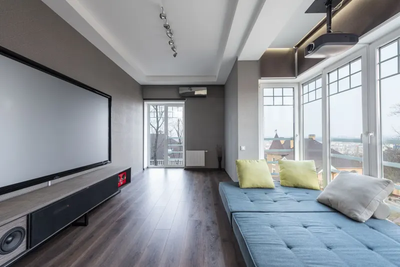 Media room with mounted screen and sound