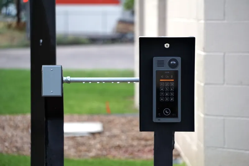 Gate keypad and call box on a post